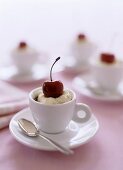 Coffee cream with cherry in coffee cup