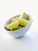 Lime wedges in a bowl
