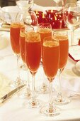 Sparkling wine cocktail with rose hip puree