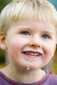 Small boy with milk around his mouth