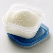 Sugar Crystals in Plastic Storage Container