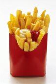 French Fries in Red Fast Food Box with Ketchup and Mayonnaise