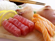 An Assortment of Sushi with Tuna and Salmon on Wooden Block