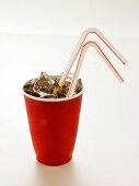 Cola in a Red Plastic Cup with Ice and Straws