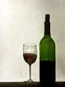 Glass of Red Wine with Bottle
