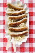 Sausages with sauerkraut on paper plate