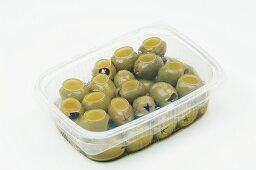 Green olives in a plastic container