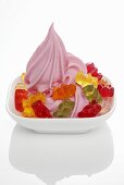 Strawberry yogurt ice cream garnished with gummy bears
