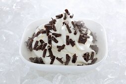 Yogurt ice cream garnished chocolate curls