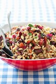 Orzo Salad with Olives and Sun Dried Tomatoes; In a Serving Bowl