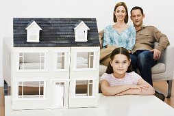 Family with model house