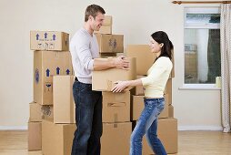 A couple with cardboard boxes