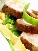 Roast pork with noodles, beans and peas