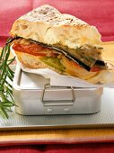 Sandwich with vegetables and cream cheese on lunch box