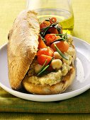 Vegetarian sandwich with hummus and cherry tomatoes
