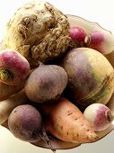 Various types of root vegetables in bowl