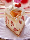 A piece of summery fruit gateau with cream