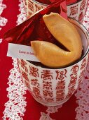 Fortune cookie on Chinese cup