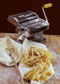 Home-made tagliatelle, flour and pasta maker