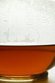 Hot fruit tea in glass teapot (detail)