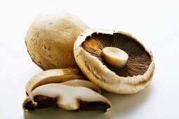 Portobello mushrooms, some sliced