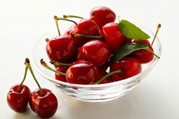 Fresh red cherries in glass bowl