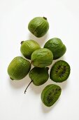 Mini-kiwi fruits, one halved