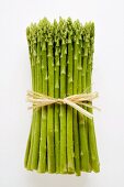Bundle of green asparagus with drops of water