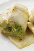 Fish rolls with pesto and white sauce