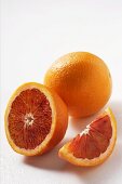 Blood oranges (whole, halved and wedge)