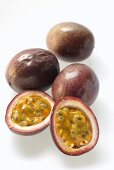 Passion fruits, one halved (Purple granadilla)