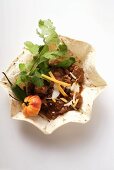 Chili con carne with cheese and sour cream in tortilla shell