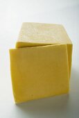 Semi-hard cheese with a slice cut