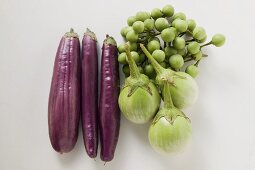 Green and purple baby aubergines