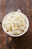Udon noodles in white bowl