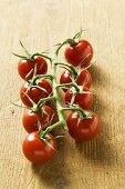 Cherry tomatoes on wooden background