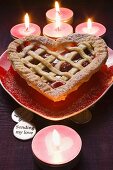 Cherry pie on heart-shaped plate for Valentine's Day