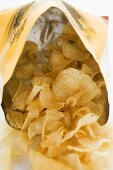Potato crisps in opened bag
