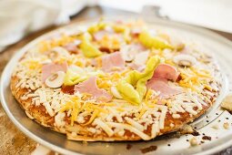 Pizza with ham, mushrooms, peppers and cheese