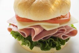 Ham, cheese and tomato in kaiser roll