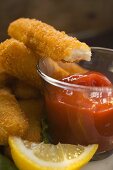 Fish finger with ketchup (a bite taken)