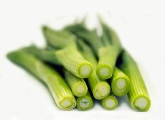 Several spring onions with the ends cut off