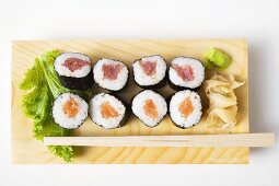 Maki sushi with tuna and salmon on sushi board