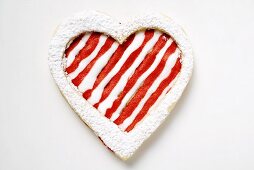 Heart-shaped biscuit with red and white icing