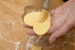 Heart-shaped biscuit with pastry brush