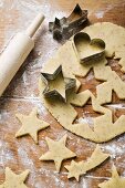 Cutting out heart-shaped and star-shaped biscuits