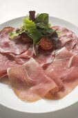 Various types of Italian ham with salad garnish