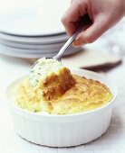 Cheese soufflé with spoon