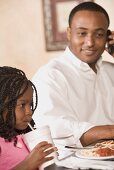 Father and daughter in restaurant