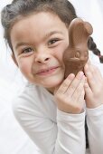 Girl with a chocolate Easter Bunny